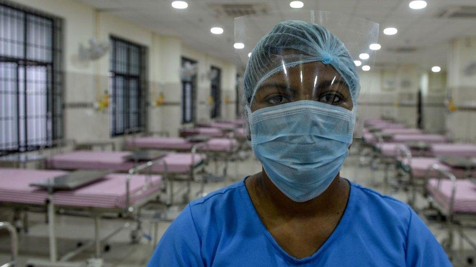 A medical staff wearing a facemask poses in an isolation ward at a newly inaugurated hospital by the Tamil Nadu state during a government-imposed nationwide lockdown as a preventive measure against the COVID-19 coronavirus, in Chennai on March 27, 2020.