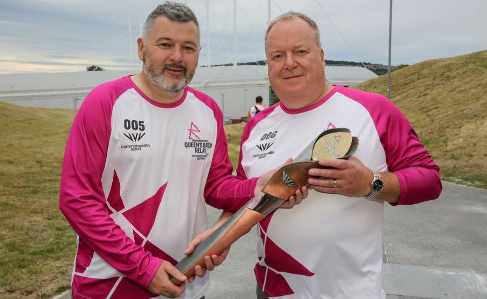 Baton bearers Lee Brown and Dave Bebbington hold the Queen's Baton during the Birmingham 2022 Queen's Baton Relay on a visit to Sheffield Olympic Legacy Park