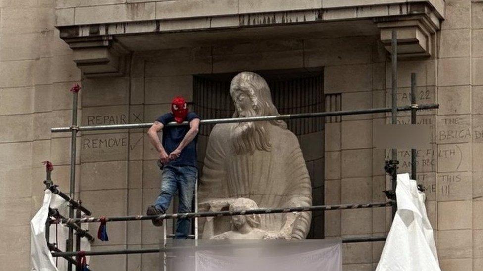 A man on scaffolding on the BBC's HQ