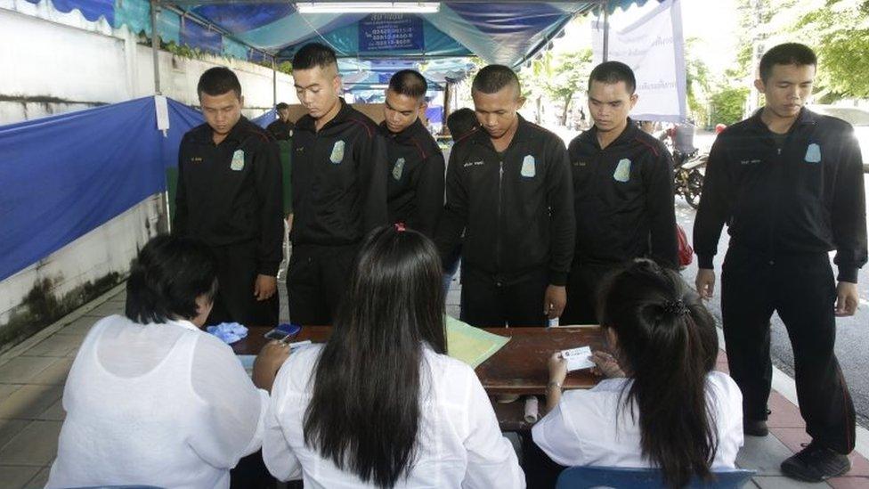 Thai soldiers queue up to vote at a polling station in Bangkok. Photo: 7 August 2016