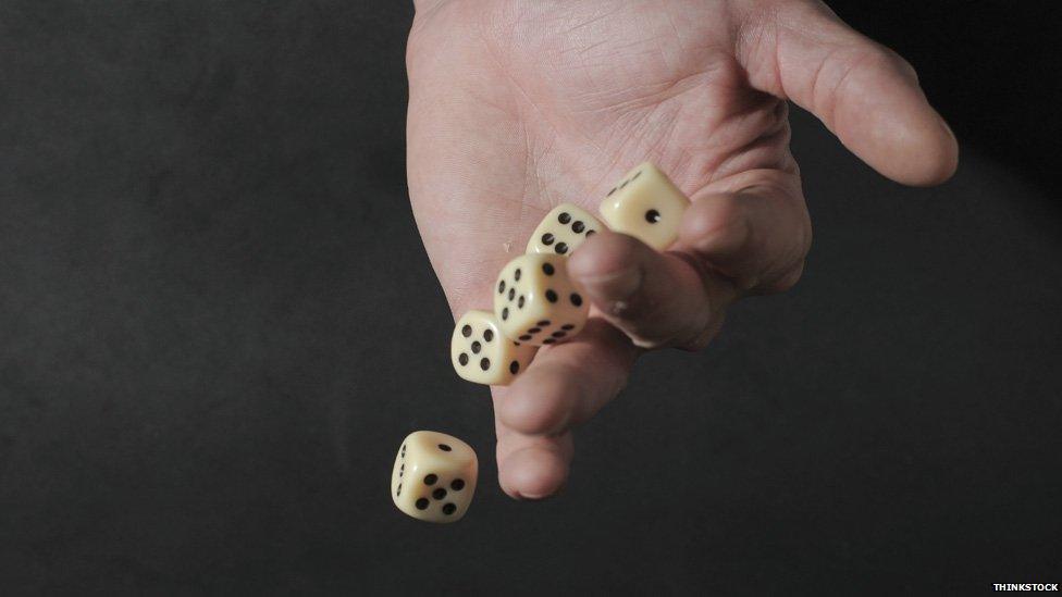 Hand throwing dice