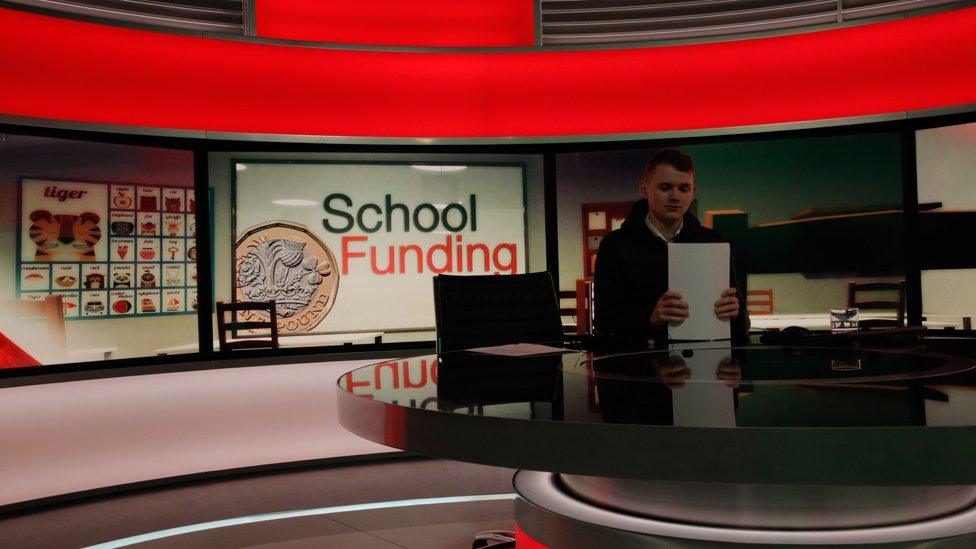 In the hot seat - a student presents the news from the BBC Newsline studio