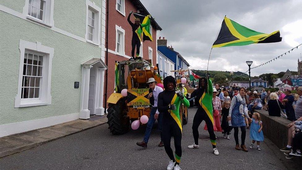 Men blacked up as the Jamaican bobsleigh team at Aberaeron carnival