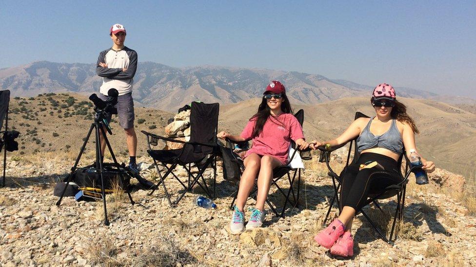 Sabrina (centre) watches a solar eclipse in Idaho in the US in 2017