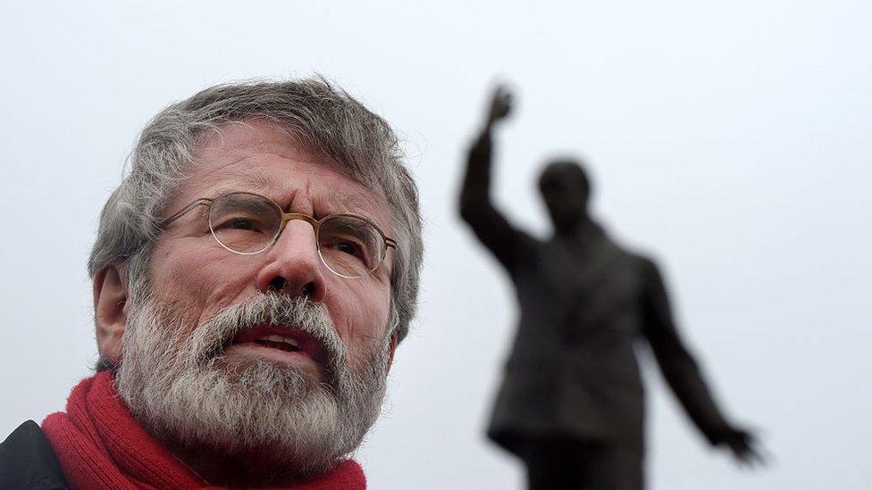 Gerry Adams under Edward Carson statue