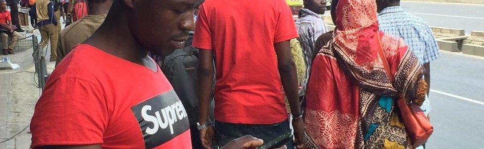 Man with phone in Dar es Salaam