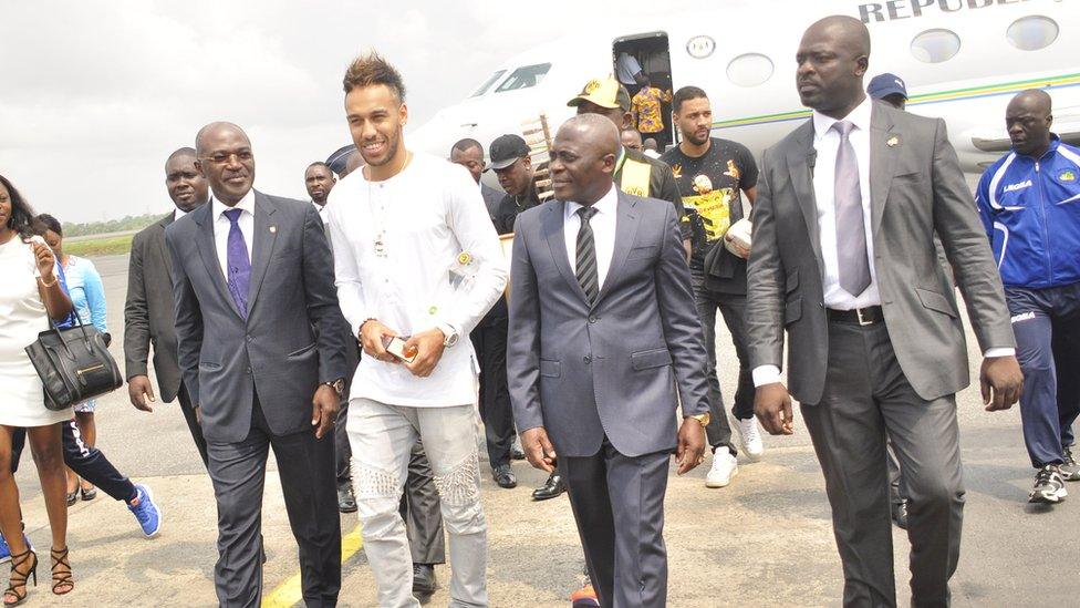 Pierre-Emerick Aubameyang lands in Libreville, Gabon, with the plane in the background