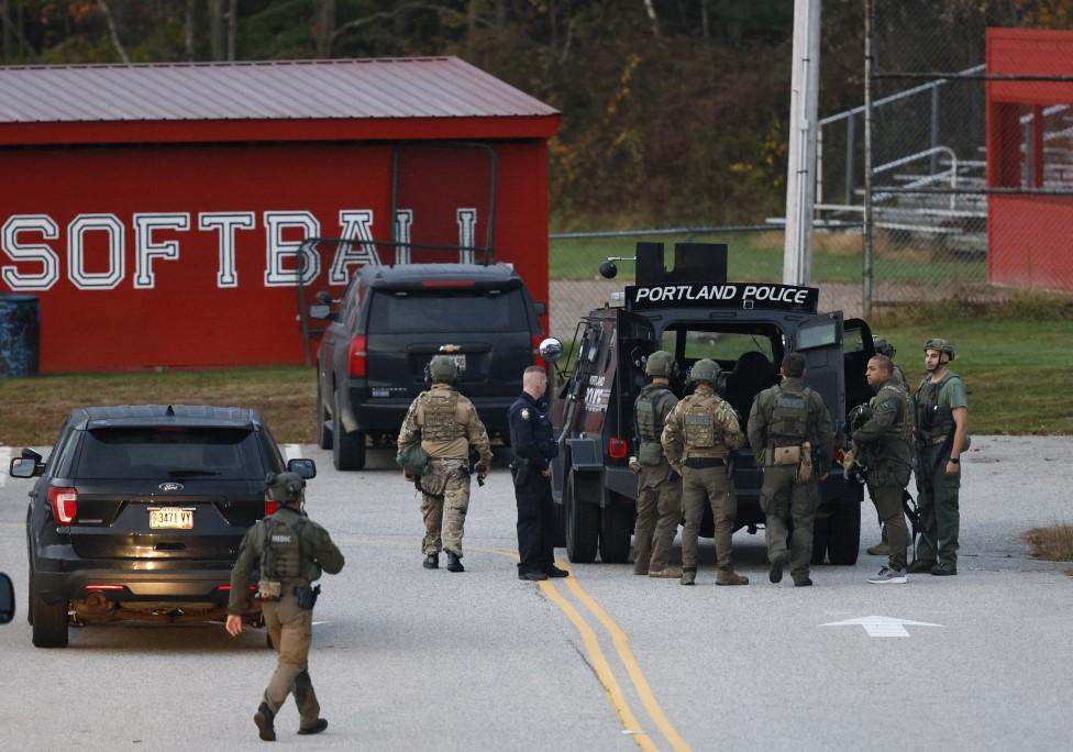 Law enforcement officials at Lisbon High School at daybreak