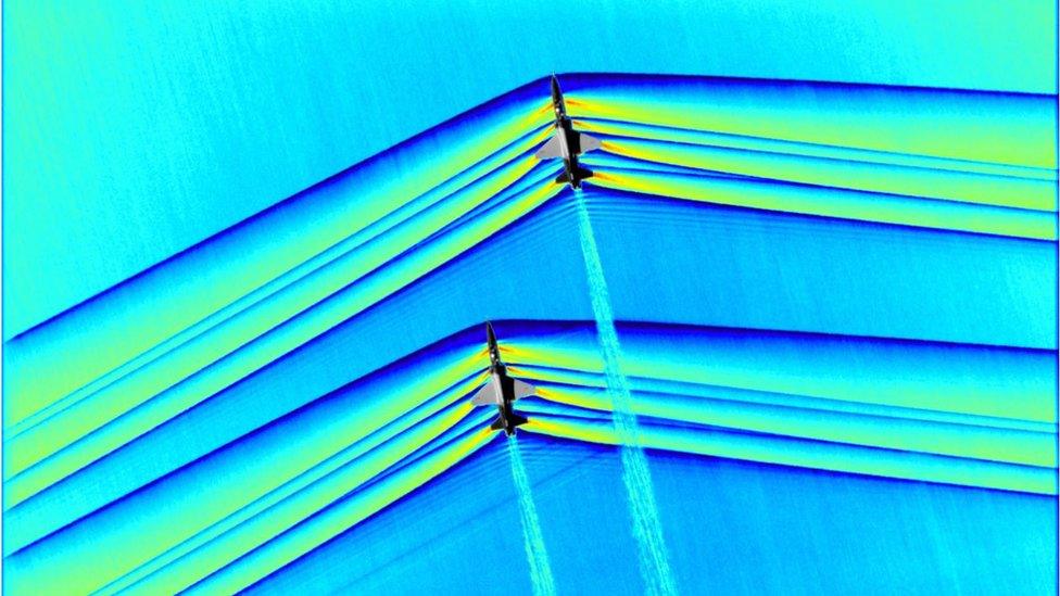 A picture showing the supersonic waves of two aircraft.