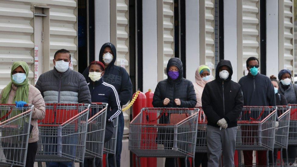 Shoppers wearing masks