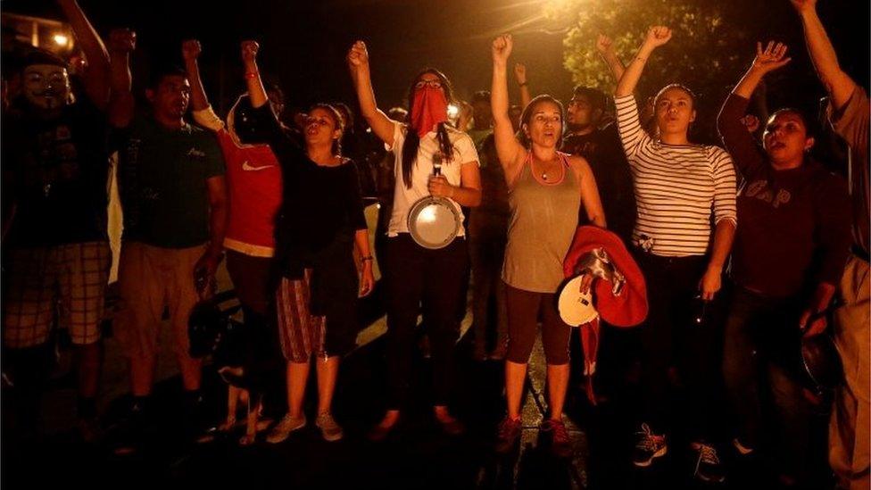 Supporters of Salvador Nasralla, presidential candidate for the Opposition Alliance Against the Dictatorship, sing the national anthem during a curfew while the country is still mired in chaos over a contested presidential election in Tegucigalpa, Honduras December 3, 2017