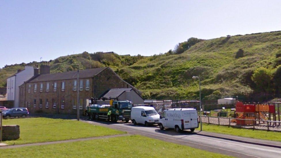 Streetview of the school in front of the hill