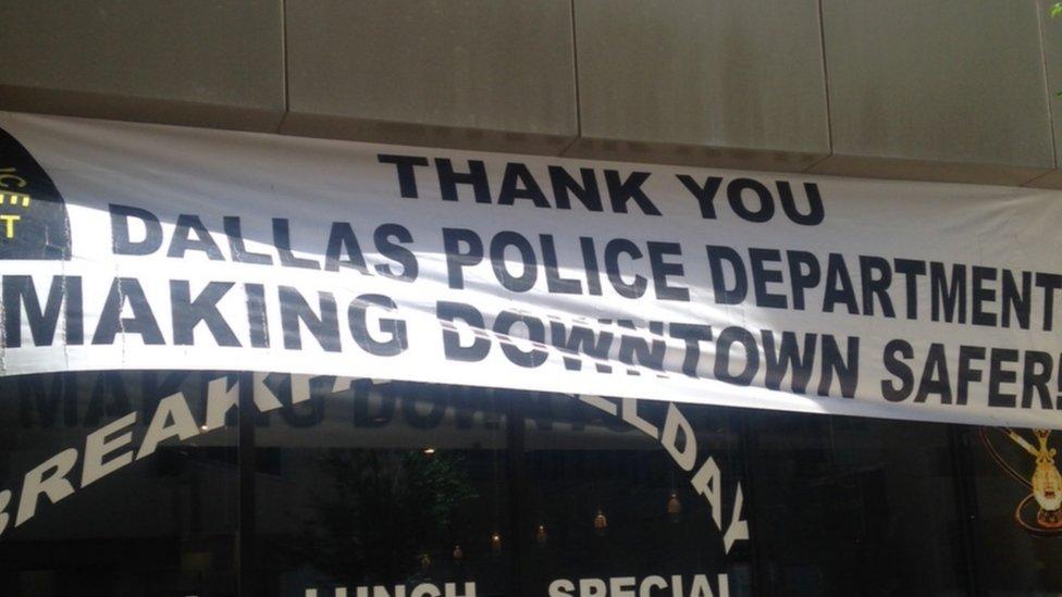 Sign at building reads: Thank you Dallas police department for making downtown safer