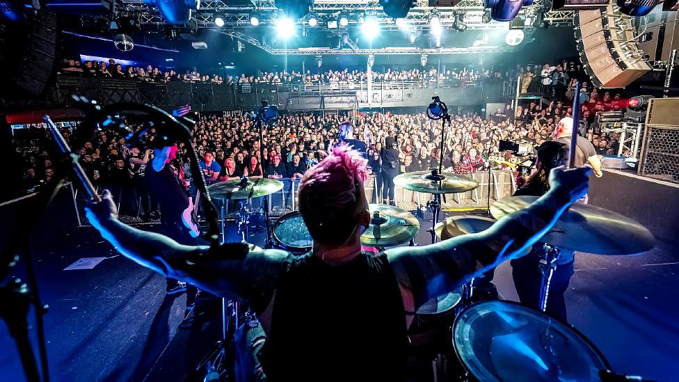 Punk Rock Factory members on stage with a view of the audience