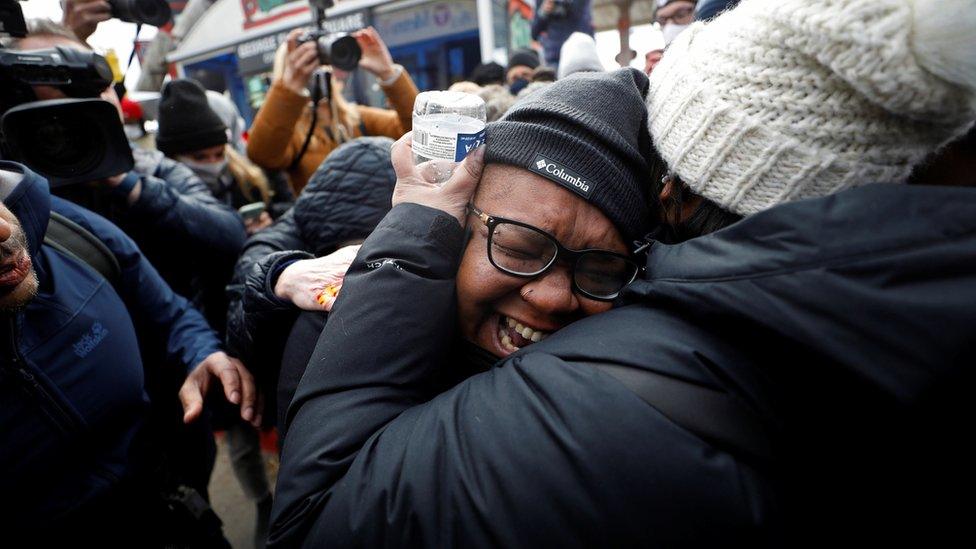 People react after the verdict in the trial of former Minneapolis police officer Derek Chauvin, found guilty of the death of George Floyd