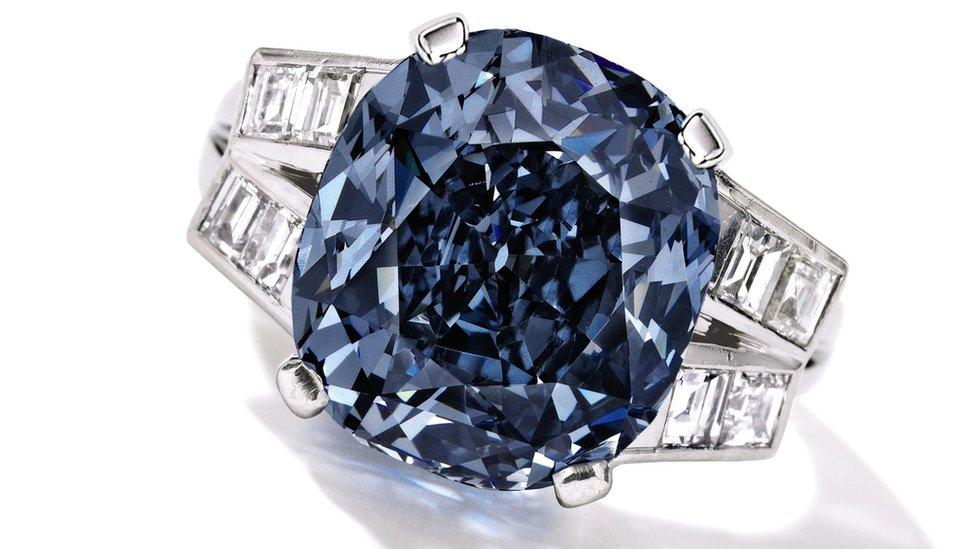 This undated photo provided by Sotheby's shows the 9.54 carat blue diamond ring worn for decades by child star-turned-ambassador Shirley Temple, which is going up for auction on April 19, 2016 by Sotheby's in New York