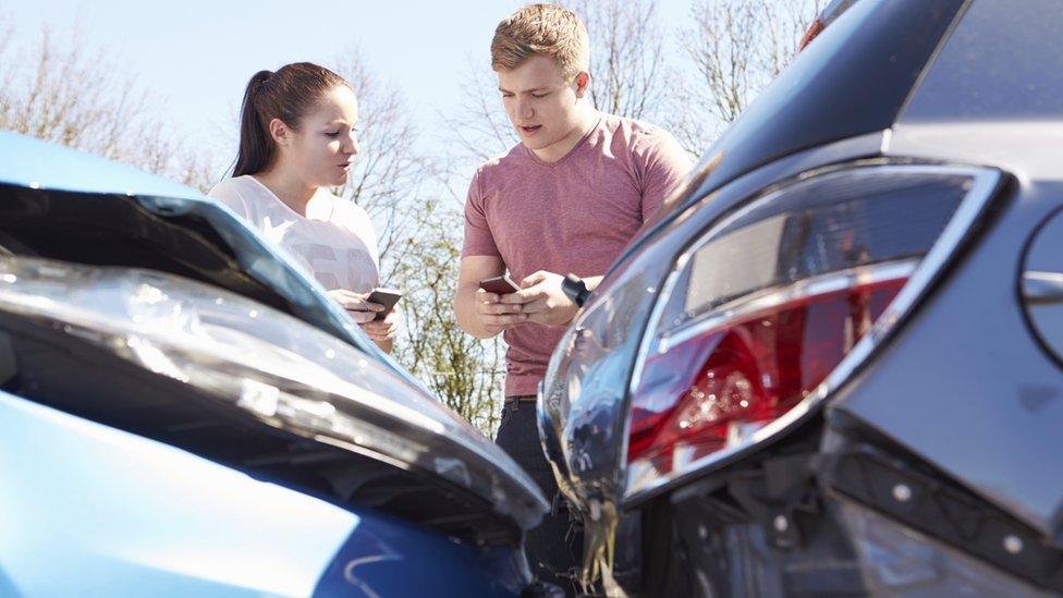 man and woman after car crash