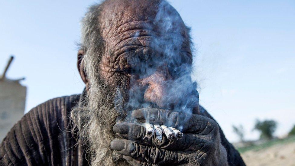 Amou Haji (uncle Haji) is pictured on the outskirts of the village of Dezhgah in the Dehram district of the southwestern Iranian Fars province, on December 28, 2018