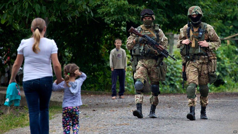 Ukrainian government forces soldiers patrol the area at Bobovysche village near Mukachevo, Ukraine