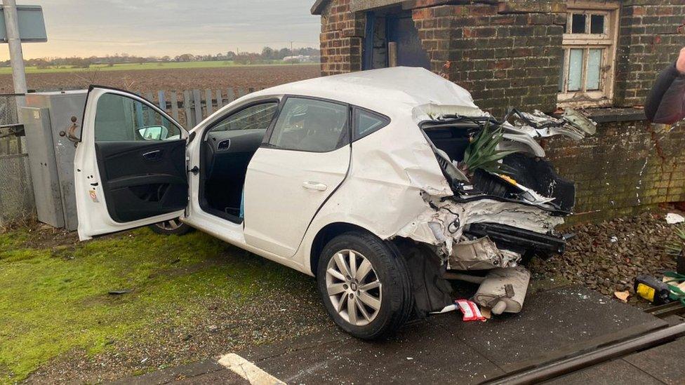 Crashed car at side of rail track