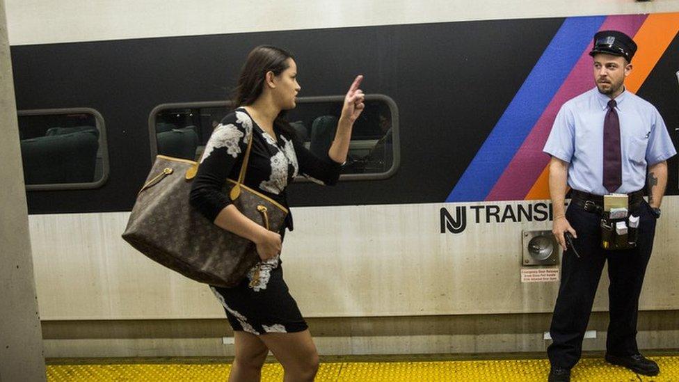 Woman running to catch an East Coast Amtrak Train Service