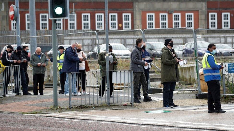 People queuing for a test in Bolton