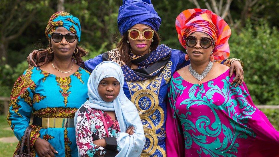 Members of Southwark's Muslim community pose for a photograph during Eid celebrations in Dulwich Park, London, 25 June