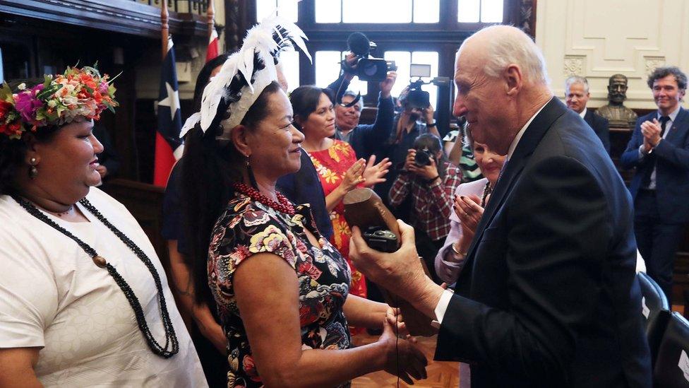 King Harald V of Norway speaks with members of the Easter Island community