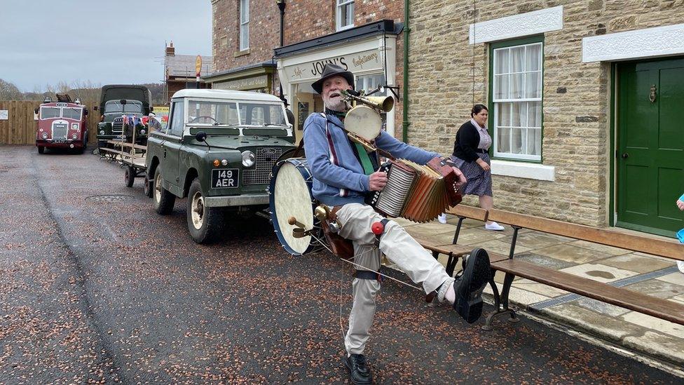 One man band at the opening of 1950s Front Street