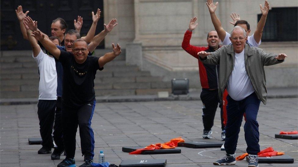 Peruvian President Pedro Pablo Kuczynski 77, and part of his cabinet taking a morning workout session in the main patio of the presidential palace in Lima on August 4, 2016