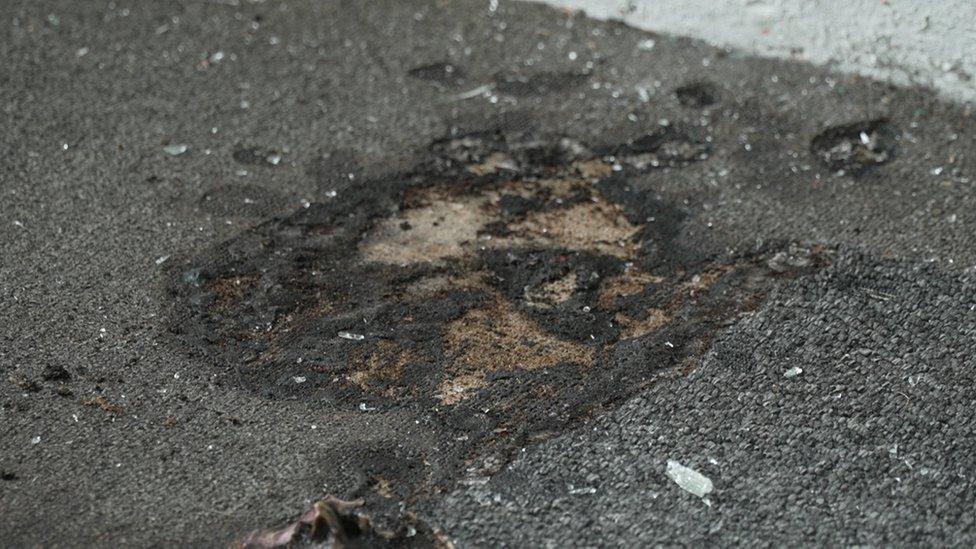 Damaged carpet at car sales business in Ballynahinch