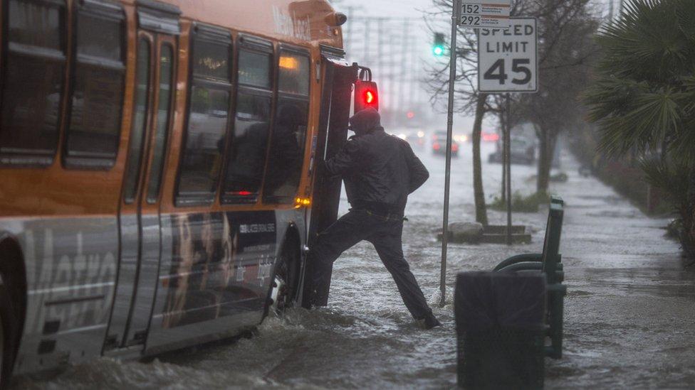 Man escapes flooding by getting on to bus