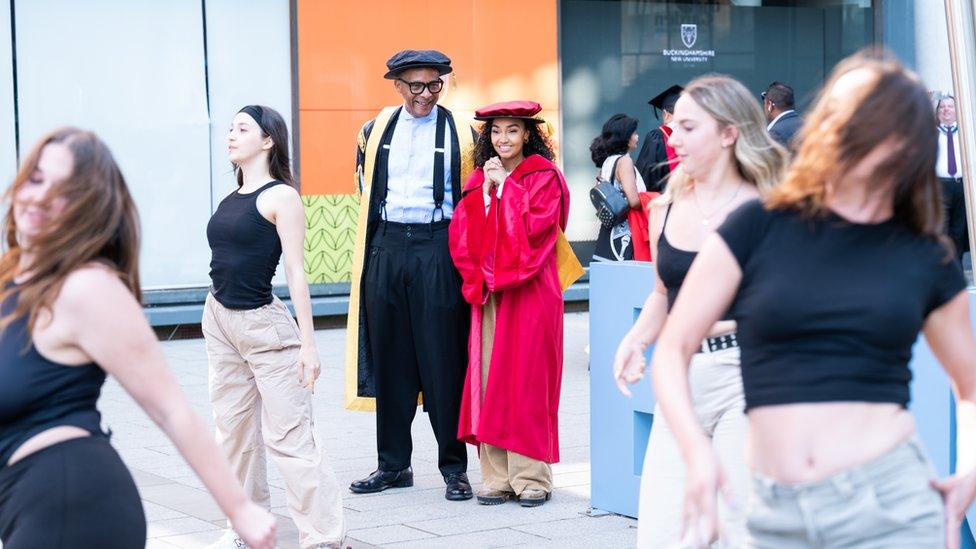 Jay Blades and Leigh-Anne Pinnock are greeted by a flash mob