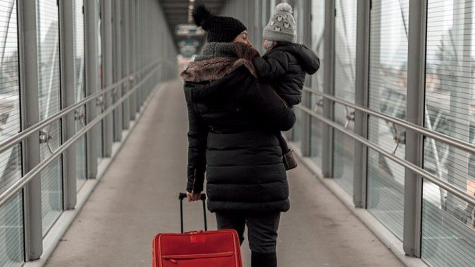 Woman and child at airport