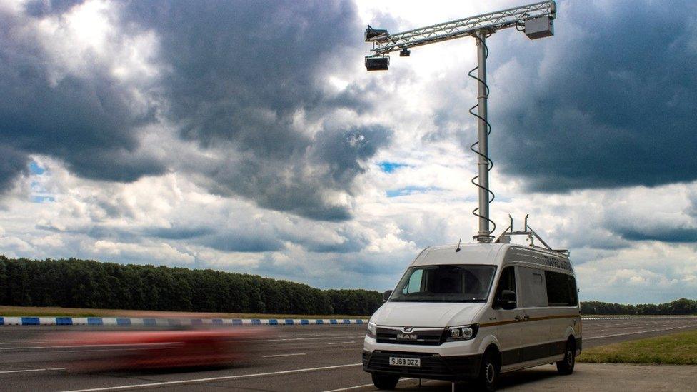 A van with a camera coming from the roof