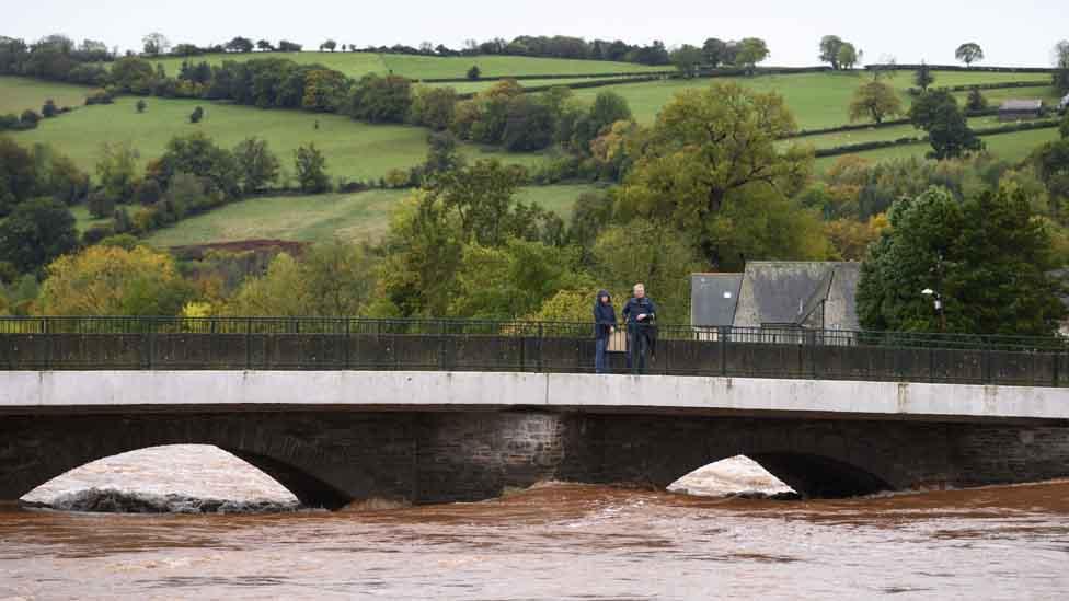 A river overflows during Storm Dennis