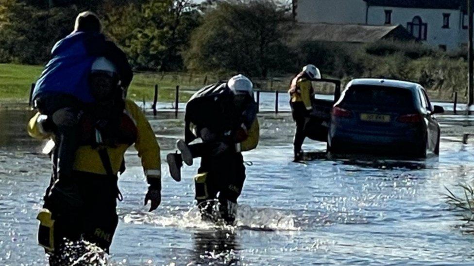 Silloth RNLI volunteers rescuing a couple from a car