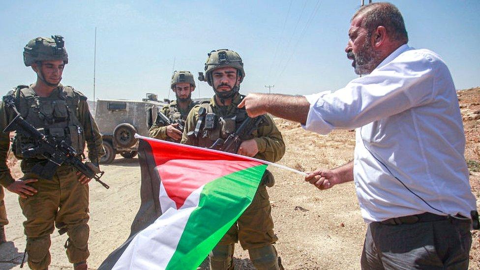 Palestinian protesters confront Israeli soldiers during the demonstration against Israeli settlements in the village of Beit Dajan near the West Bank city of Nablus