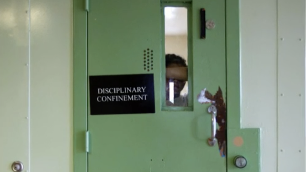 An inmate in a cell