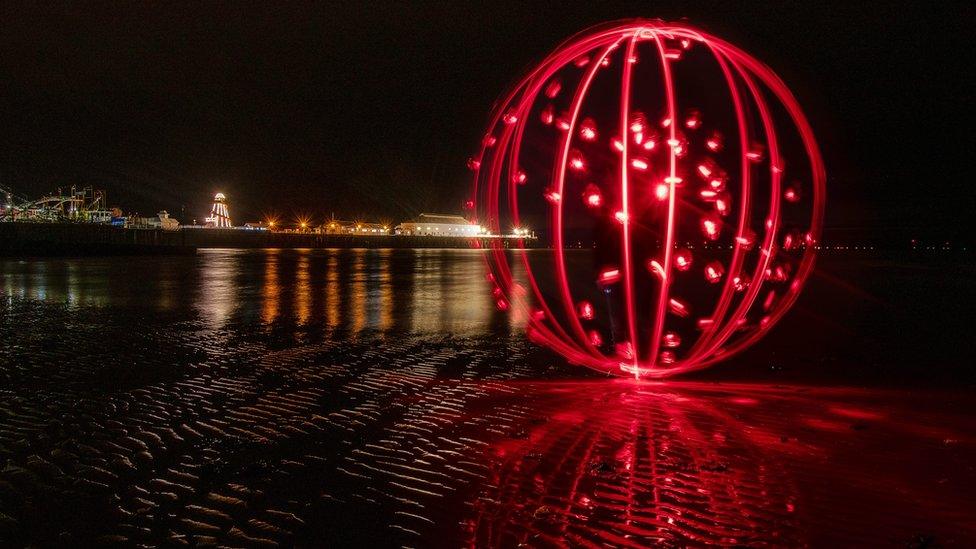 Orb of light created by light painting technique at Clacton beach