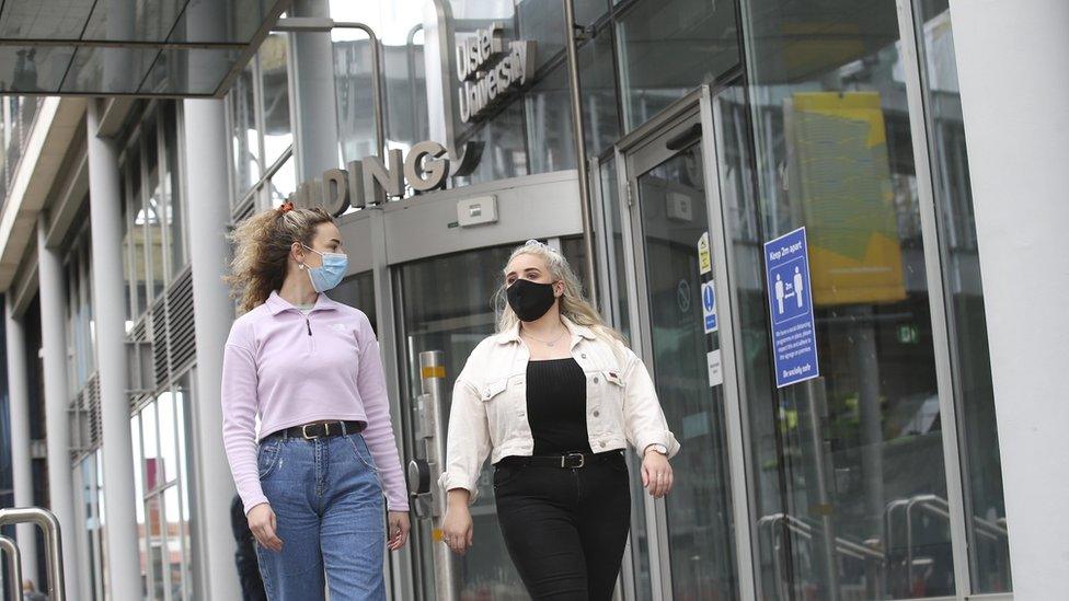 two students outside an Ulster University building