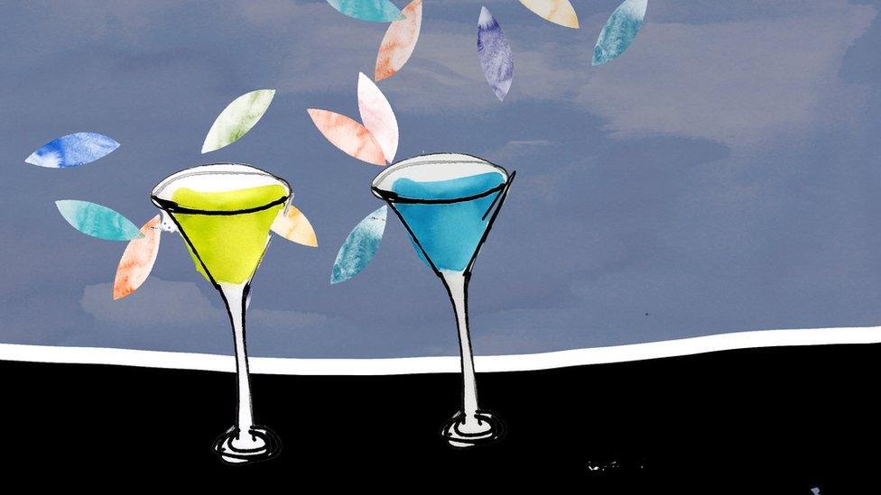 Cocktail glasses stand on a bar