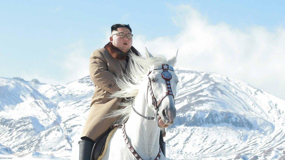 North Korean leader Kim Jong Un rides a horse during snowfall in Mount Paektu