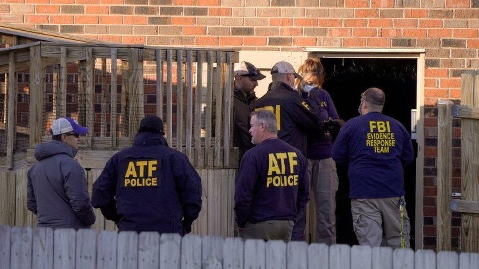 Law enforcement officers search the property of a possible person of interest in Antioch, near Nashville. Photo: 26 December 2020