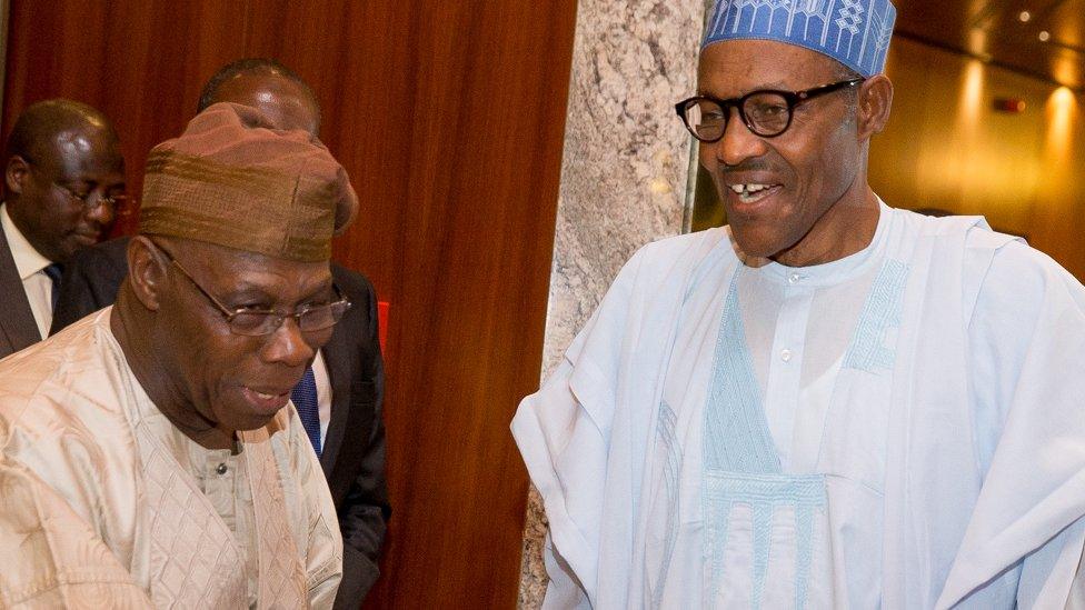 Ex-President Olusegun Obasanjo and President Muhammadu Buhair shaking hands in 2015