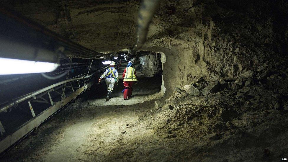 Two miners on shift at a South African mine