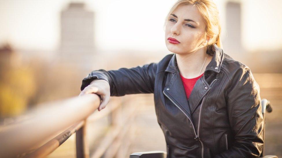 Stock photo of woman in wheelchair