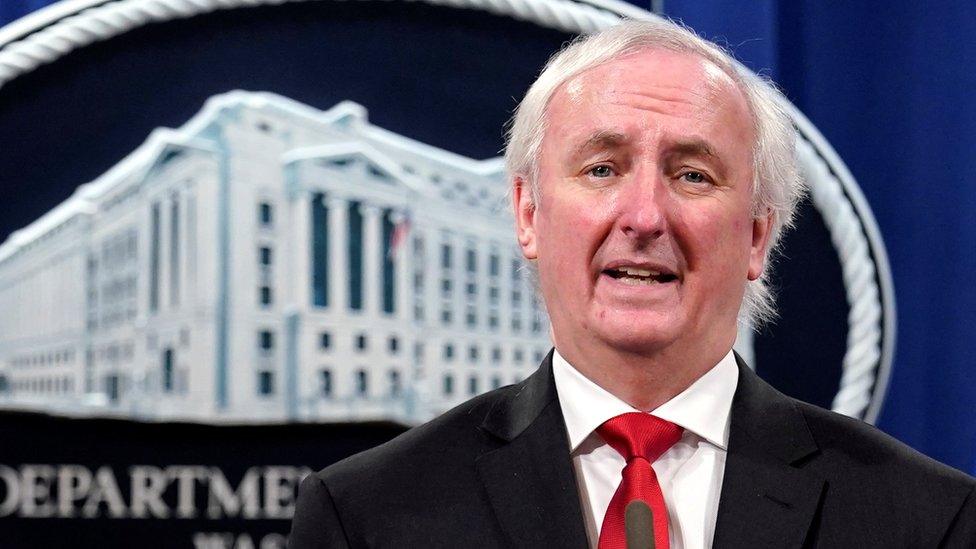 Deputy Attorney General Jeffrey Rosen in front of a Department of Justice backdrop