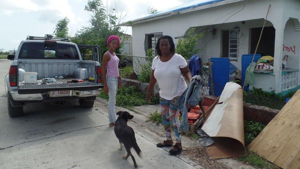 Juliette Warner and daughter Cheniesha, 16, at work clearing debris