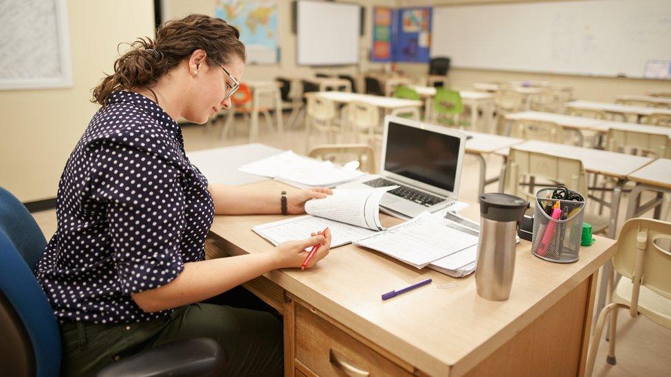 teacher at desk